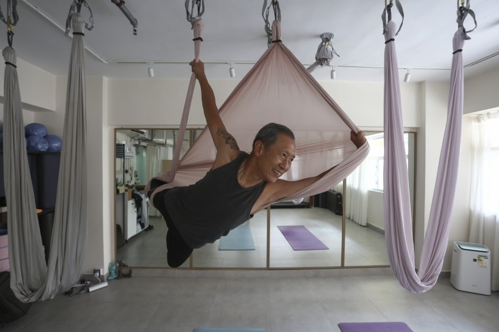 Dave Lau takes part in an aerial yoga session in Jordan, Hong Kong. At 75 years old, Lau is a great example of how staying active can give you a longer, healthier life. Photo: Jonathan Wong