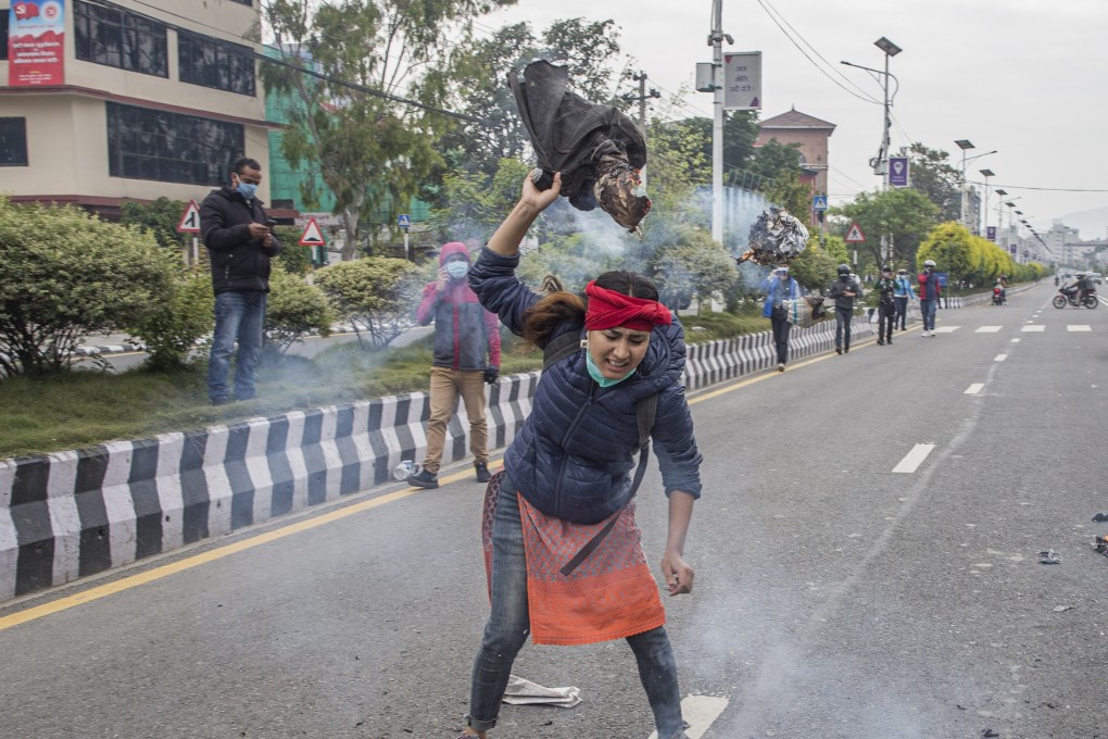 A Nepali activist burns an image of Indian Prime Minister Narendra Modi during a May protest against India’s unilateral construction of a link road that passes through some territories also claimed by Nepal. Photo: EPA