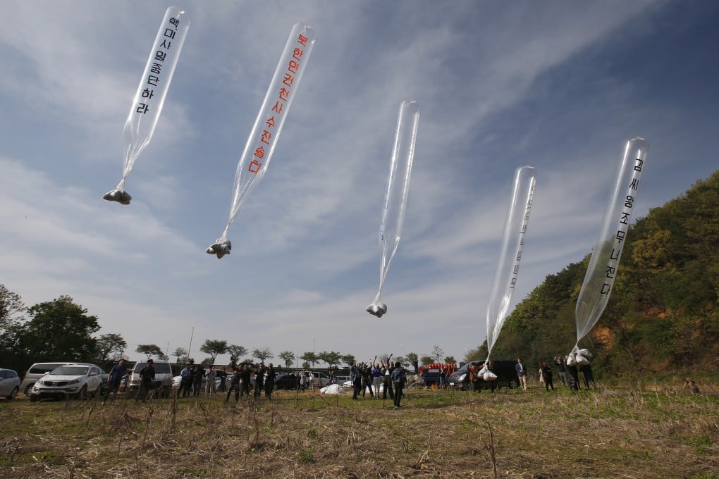 Members of defector organisation Fighters for Free North Korea release balloons carrying anti-Pyongyang leaflets across the border in this 2016 file photo. Photo: EPA