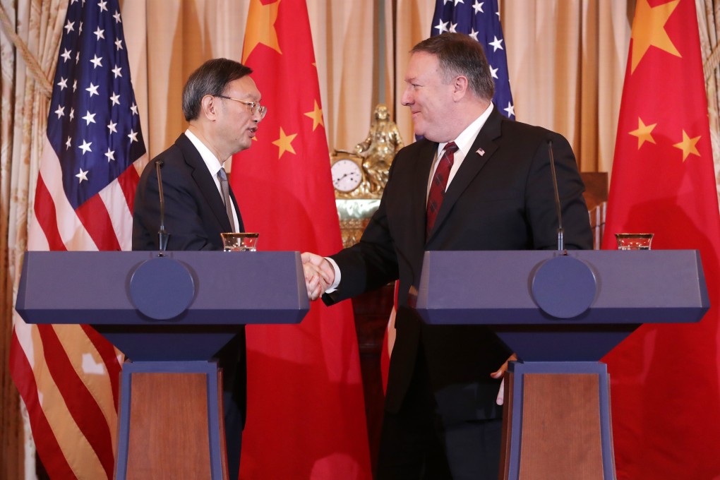 Beijing’s top diplomat, Yang Jiechi, and US Secretary of State Mike Pompeo shake hands after a joint news conference in 2018. The duo met again last week in Hawaii. Photo: Getty Images