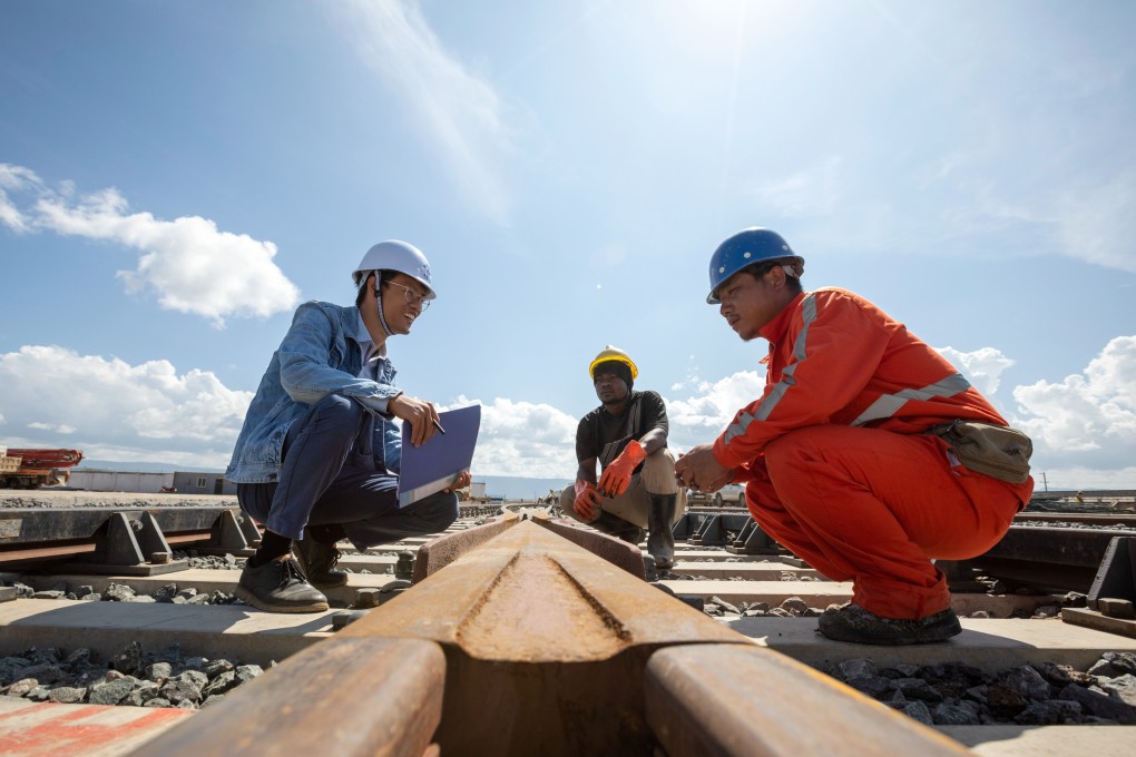 A Chinese worker (left) inspects the rails at an inland container depot in Naivasha, Kenya on January 15. Photo: Xinhua