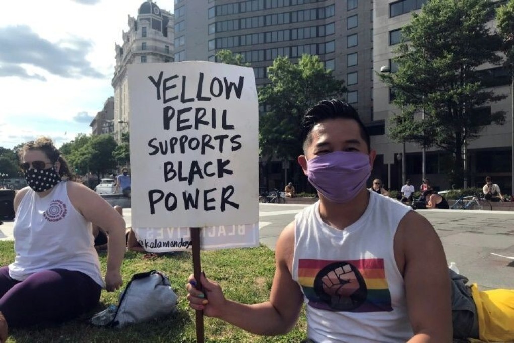 Viet Hoai Tran supporting a Black Lives Matter protest in Washington. Photo: AFP