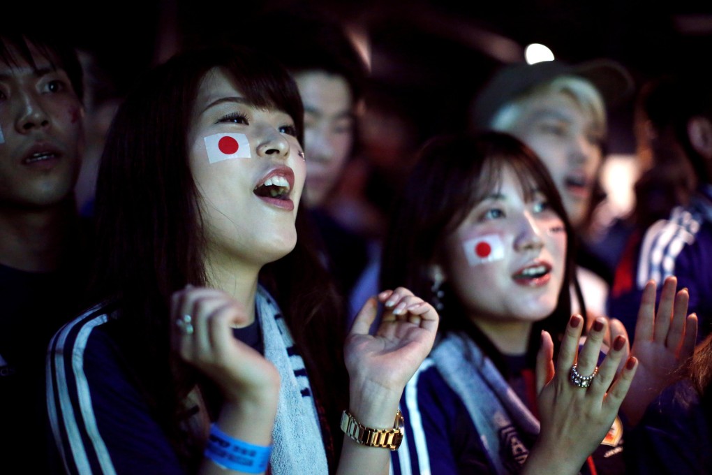 Japanese fans react as they watch a broadcast of the Fifa World Cup 2018 group H match between Japan and Senegal at a sports bar in Tokyo. Photo: Reuters