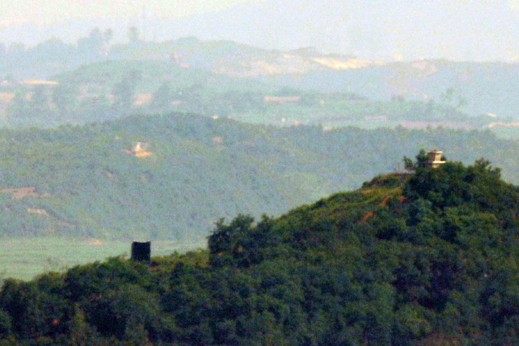 A propaganda loudspeaker (left) is seen near a North Korean guard post (right) inside the demilitarised zone, in this photo taken from the South Korean border city of Paju on June 23. Pyongyang began to reinstall loudspeakers on June 21, two years after the two Koreas removed their loudspeakers from the DMZ in adherence to the 2018 Panmunjom declaration. Photo: EPA-EFE / Yonhap
