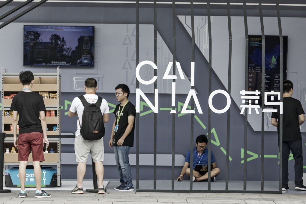 Employees and visitors at the Cainiao display at the Alibaba Group headquarters in Hangzhou, China. Photo: Bloomberg