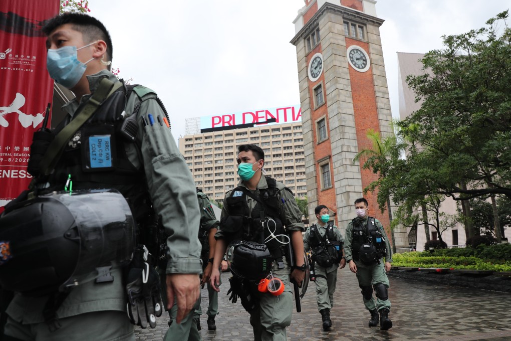 Hong Kong police stand guard near the Clock Tower in Tsim Sha Tsui. Photo: Sam Tsang