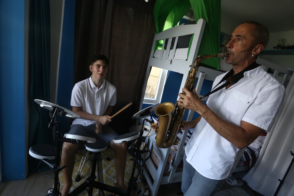 Oliver Smith, a professional musician, and his son, Liam, at home in Cheung Chau, Hong Kong. Smith took up the keto diet seven years ago and, satisfied it worked, put Liam, then aged 11 on it. Liam’s epileptic seizures have since stopped. Photo: Jonathan Wong