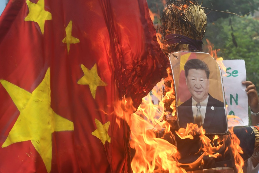 Protesters in India burn an effigy of the Chinese President Xi Jinping. Photo: AFP