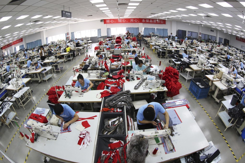 Workers making down jackets at a Bosideng factory in Changshu city in eastern Jiangsu province. Photo: Imaginechina