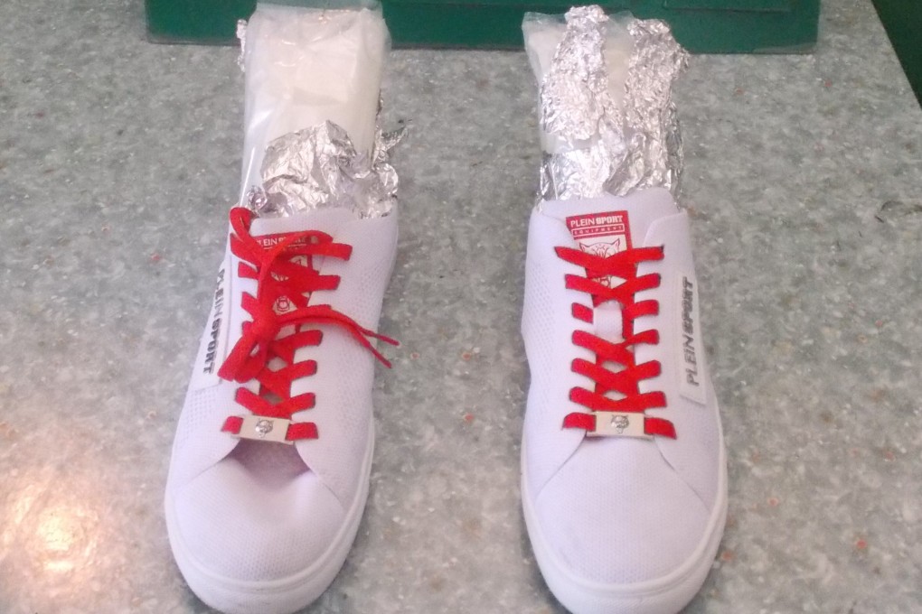 Suspected ketamine concealed inside a pair of sports shoes seized by Hong Kong customs officers as part of a special operation in late 2019 to fight against drug trafficking activities involving cross-boundary express parcels. Photo: Handout