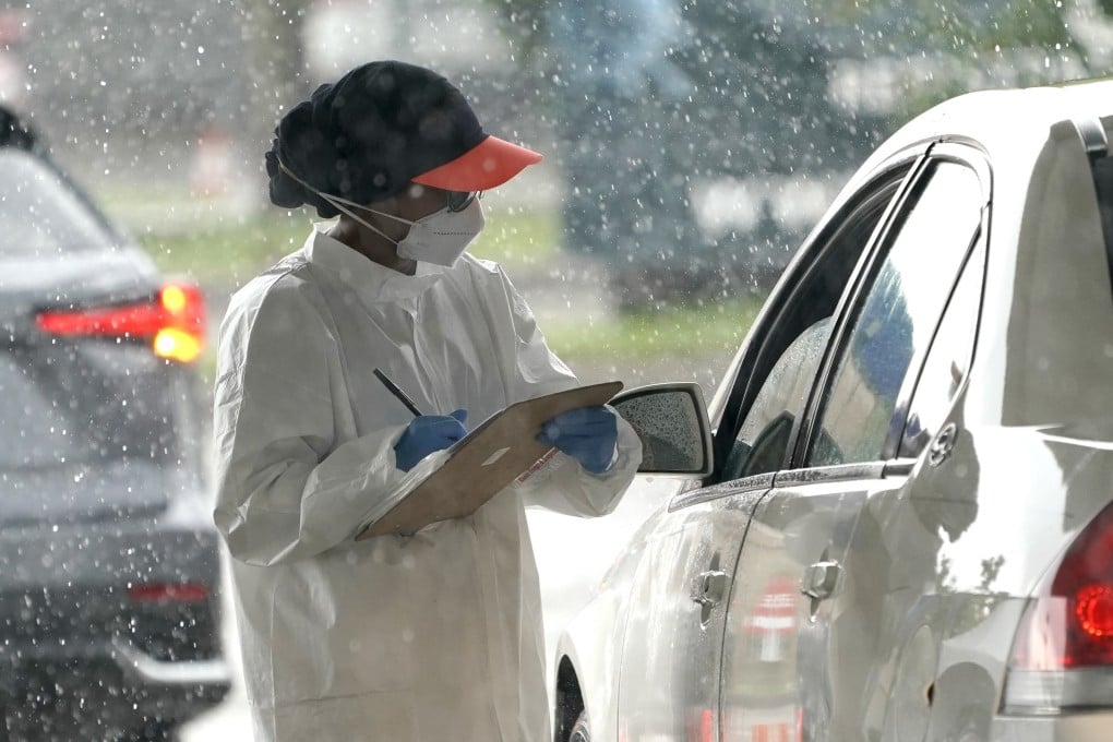 A health care worker takes down a patient’s information at a Covid-19 testing site in Houston on Wednesday. Photo: AP