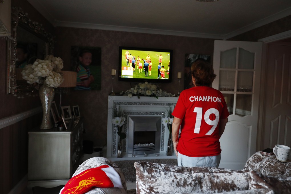 Most Liverpool supporters were forced to witness the club’s once in a generation title win from their own homes, but it’s no less special to them. Photo: EPA