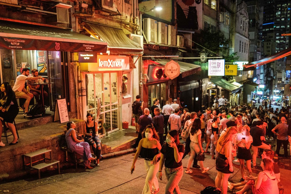 People visit bars and restaurants in Peel Street, Central, Hong Kong. Some local Chinese people don’t like to eat out in Central and Mid-Levels because they think there are too many “gweilos” (a pejorative Chinese term for white people), Andrew Sun writes. Photo: AFP