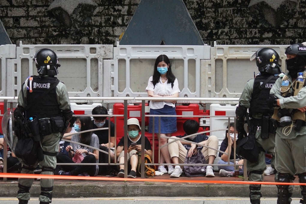 Police detain protesters who had gathered in opposition to the national security law, in Wan Chai on May 27. Photo: Winson Wong