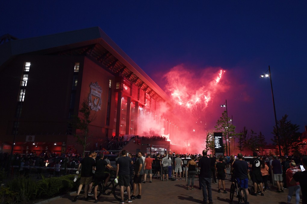 Liverpool fans celebrate outside Anfield after the Premier League title win. Photo: EPA
