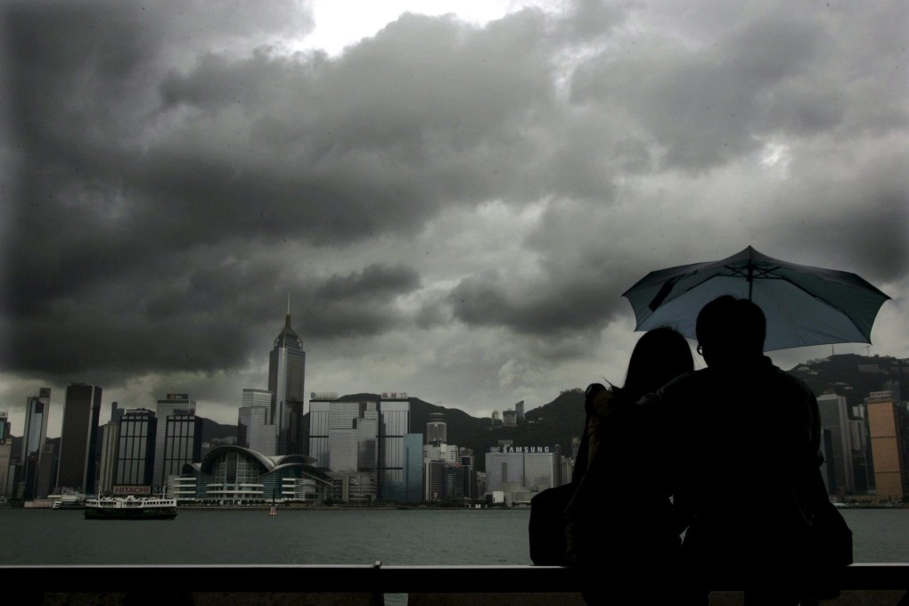 Clouds gather over the Hong Kong skyline. Photo: EPA