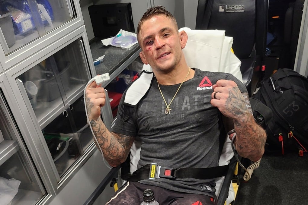 Dustin Poirier poses for a picture on a stretcher in an ambulance after his fight with Dan Hooker. Photo: Twitter