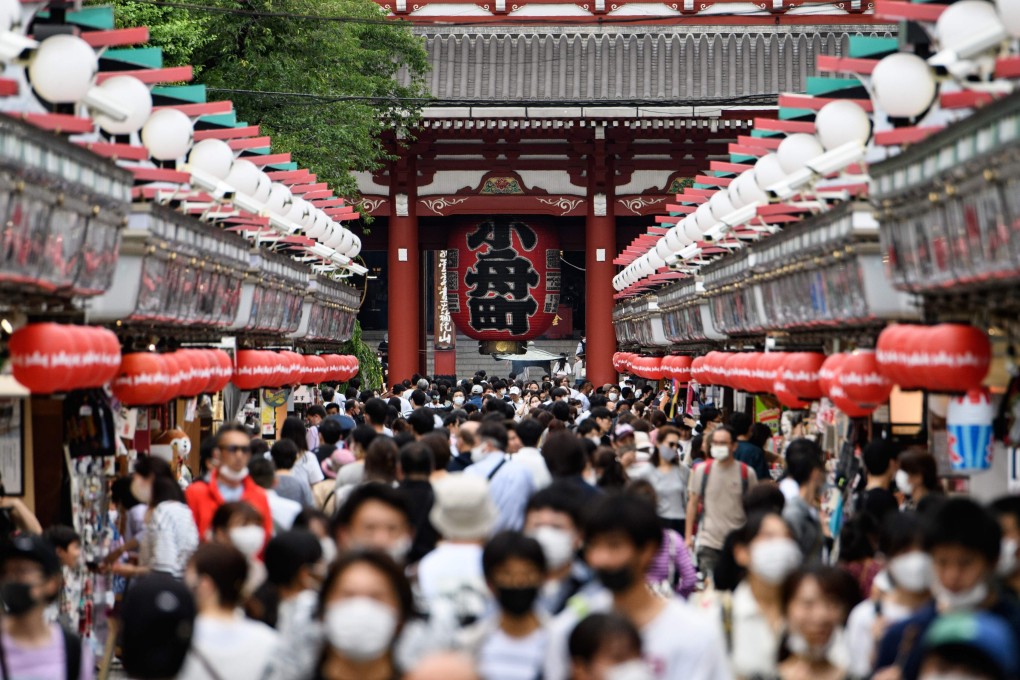People in face masks visit Sensoji temple in Tokyo on June 28, 2020. The coronavirus outbreak has pushed japan’s economy towards recession. Photo: AFP