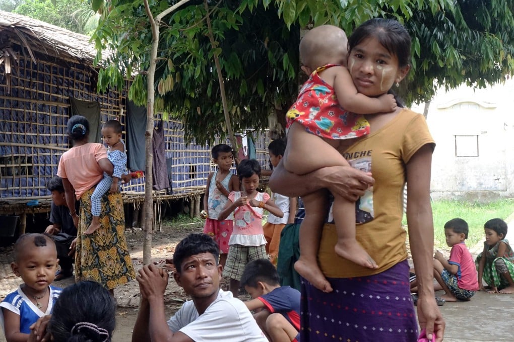 Residents, who fled from a feared conflict between the Myanmar army and the Arakan Army arrive at a temporary refugee camp at a monastery in Sittwe, Rakhine State. Photo: AFP