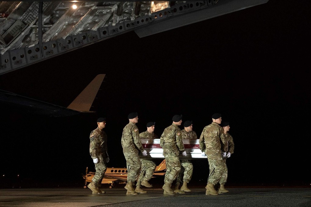 The remains of two US soldiers killed in Afghanistan being transferred at Dover Air Force Base, Delaware in February this year. File photo: AFP