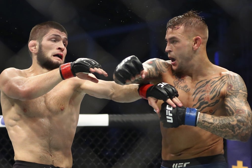 Dustin Poirier throws a punch at Khabib Nurmagomedov during their lightweight title bout at UFC 242. Photo: AP