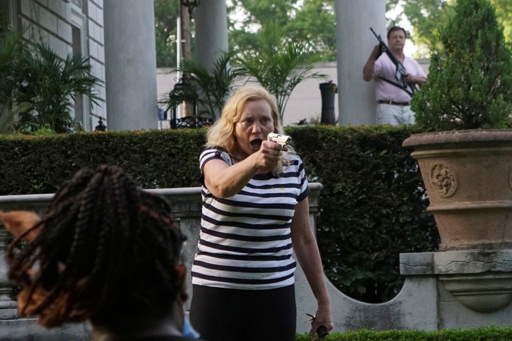 The Missouri couple brandished guns towards protesters who were calling for police reforms. Photo: Reuters