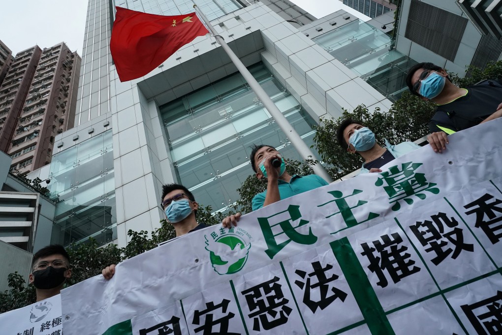 Pan-democrat lawmakers protest against a new national security law for Hong Kong, outside the central government’s liaison office in Sai Ying Pun on May 22. The law was unanimously passed by the National People’s Congress Standing Committee on June 30. Photo: Felix Wong