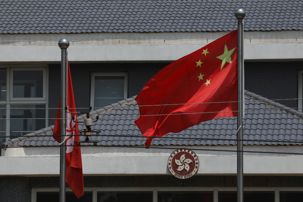 The national flag and that of Hong Kong at the Office of the Government of the Hong Kong Special Administration in Beijing. Photo: Simon Song