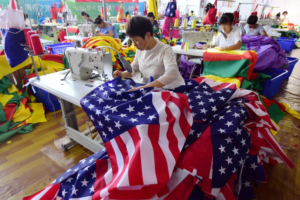 Chinese workers sew US and other flags at a factory in Fuyang, in China’s eastern Anhui province, in July 2018. China has increased trade with the rest of the world to offset the reduction of exports to the US. Photo: AFP