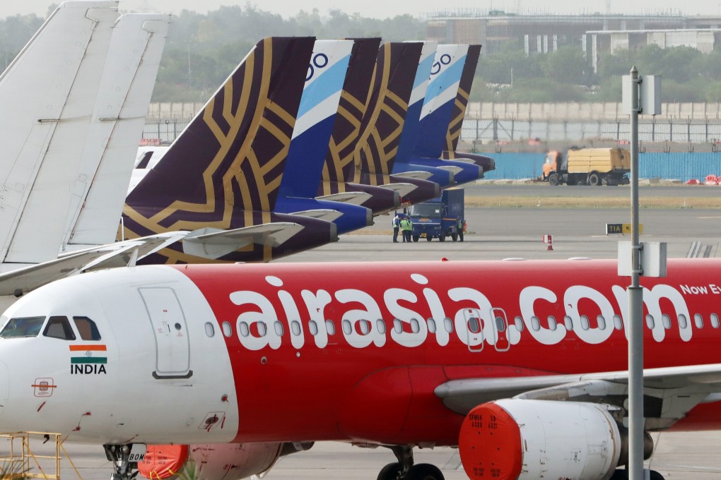 Aircraft operated by AirAsia, Vistara – a joint venture between Singapore Airlines and Tata Group – and IndiGo stand at Terminal 3 of Indira Gandhi International Airport in New Delhi. Photo: Bloomberg