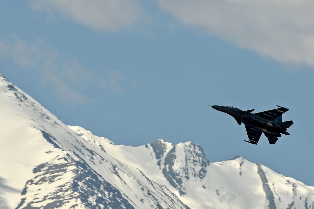 An Indian Air Force fighter flying in the mountain range surrounding Leh, near the border with China. Photo: AFP