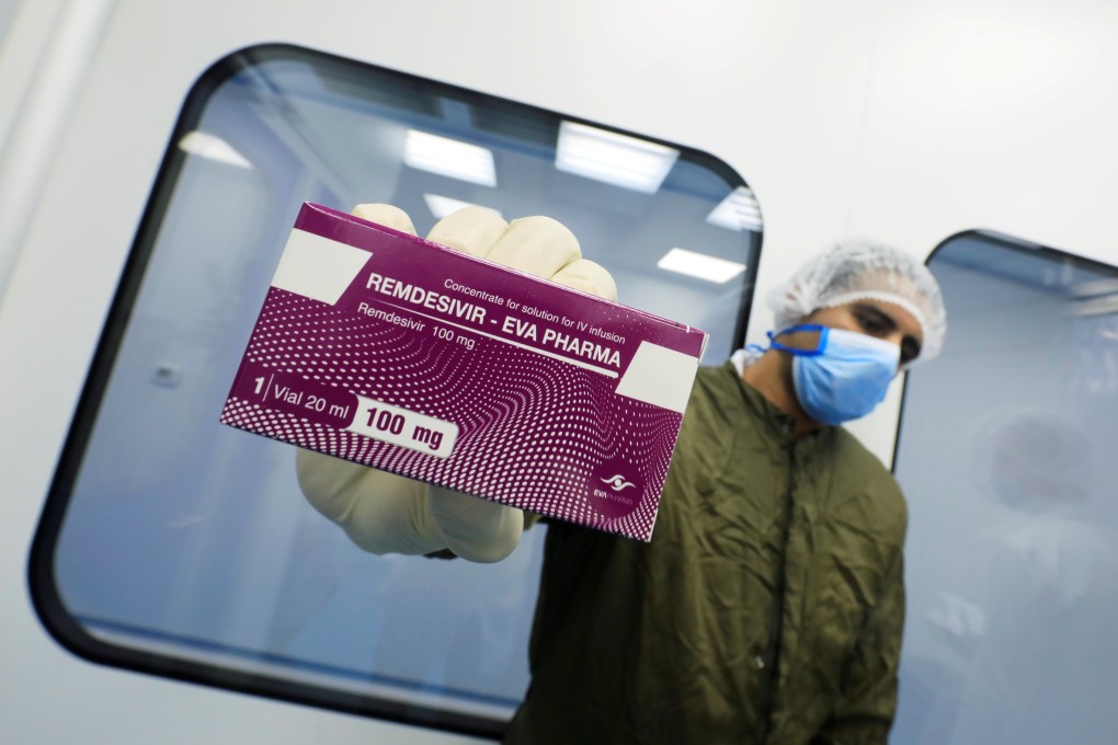 A lab technician holds a box of remdesivir at the Eva Pharma Facility in Cairo, Egypt in June. Photo: Reuters