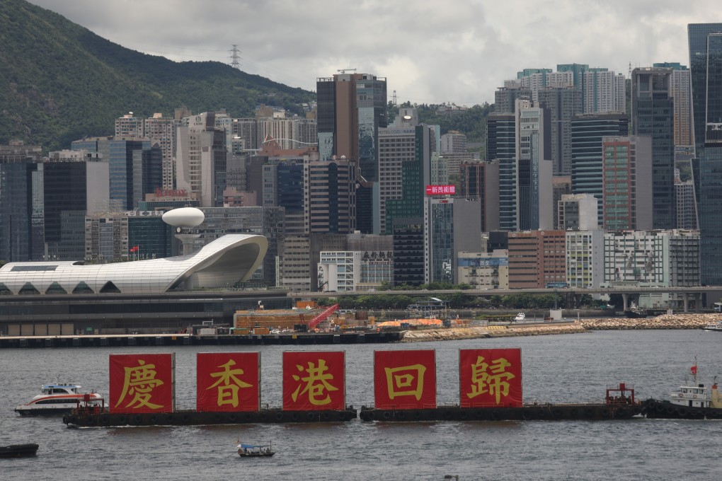 Barges with banners that read “Celebrating the return of Hong Kong” sail in Victoria Harbour on the 23rd anniversary of the handover on July 1, a day after the national security law was enacted. Photo: Xiaomei Chen
