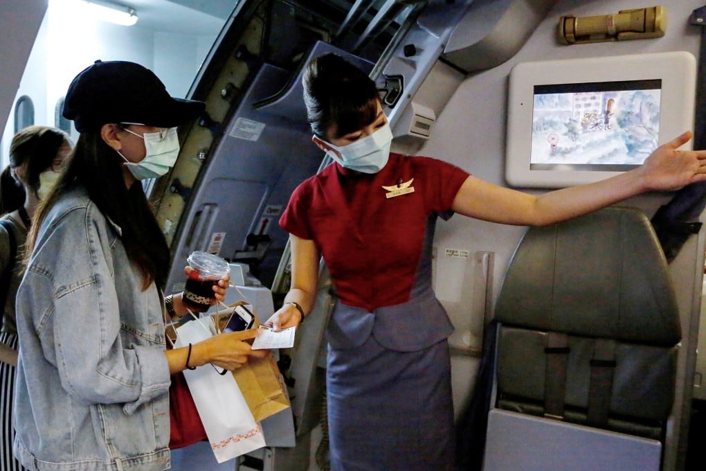 Would-be tourists take part in a “fake” travel experience for tourists at Songshan airport in Taipei on Thursday. Photo: Reuters