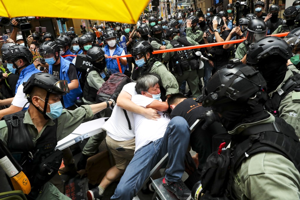 Hong Kong riot police and protesters clash on the 23rd anniversary of the city’s return to Chinese sovereignty, after the National Security Law took effect. Photo: Sam Tsang
