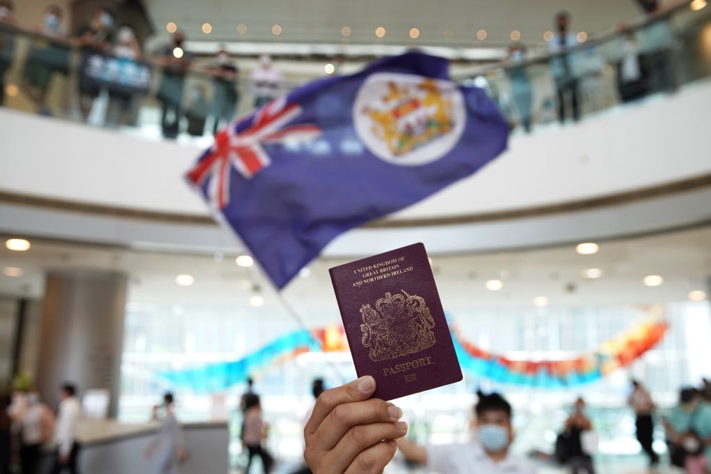 A protester holds up a BN(O) passport during an anti-government demonstration at the IFC shopping mall in Central in May. Photo: Winson Wong