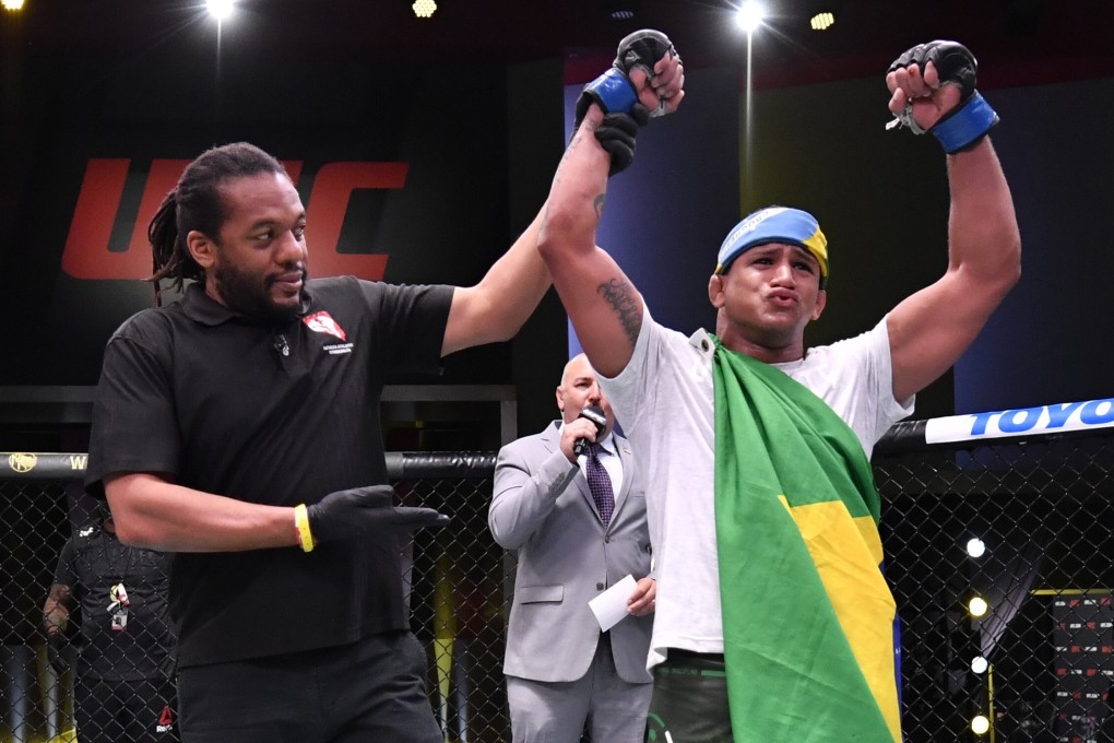 Gilbert Burns celebrates after his victory over Tyron Woodley in their welterweight bout during UFC Fight Night. Photo: USA TODAY Sports