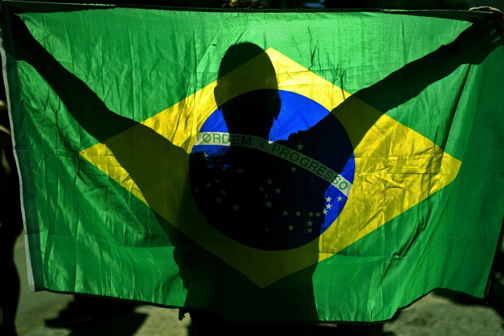 A supporter of Brazilian President Jair Bolsonaro takes part in a demonstration in Rio de Janeiro in June. Photo: AFP