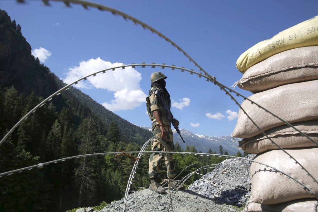 An Indian paramilitary soldier stands guard at a check post along a highway leading to Ladakh. Photo: EPA-EFE