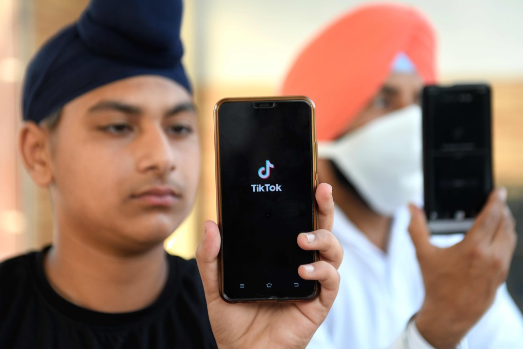 India has banned Chinese-owned video-sharing app TikTok, and mobile phones could be targeted next. Photo: AFP