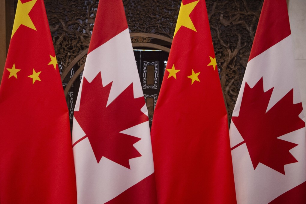 Canadian and Chinese flags taken before a meeting with Canada’s Prime Minister Justin Trudeau and China’s President Xi Jinping at the Diaoyutai State Guesthouse in Beijing. Photo: AFP