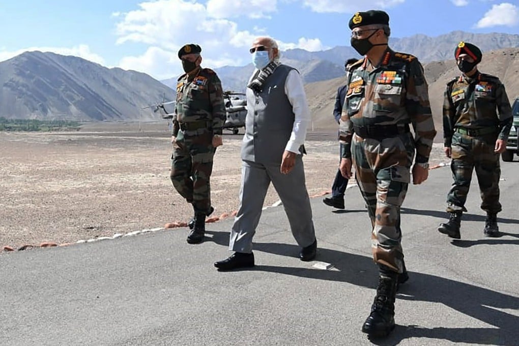 Indian Prime Minister Narendra Modi (second from left) during an unannounced visit on Friday to a military base in the remote border region with China. Photo: AP