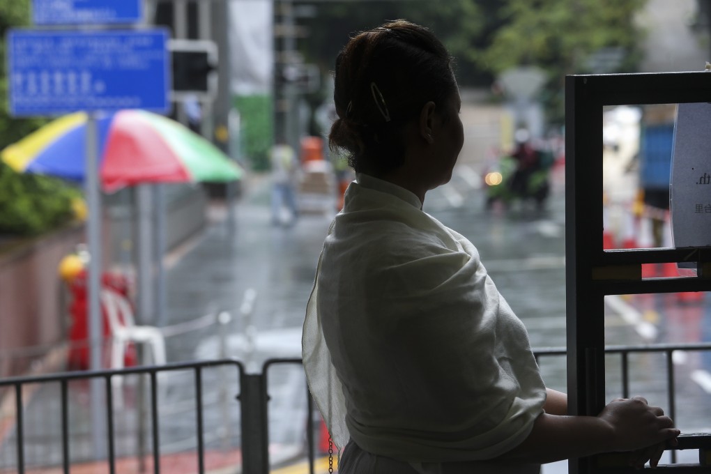 A domestic helper, the victim of human trafficking, at St John’s Cathedral in Central in 2017. Photo: David Wong