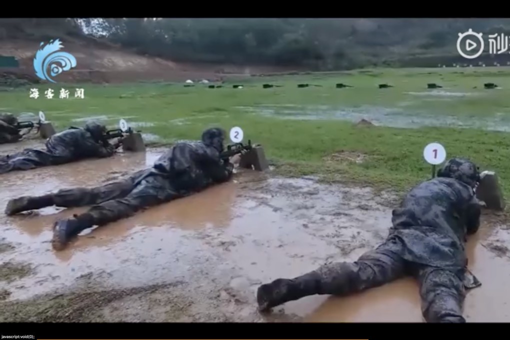 Soldiers were filmed shooting at targets while lying in the mud in an exercise described as improving their ability to “endure hardship”. Photo: Weibo