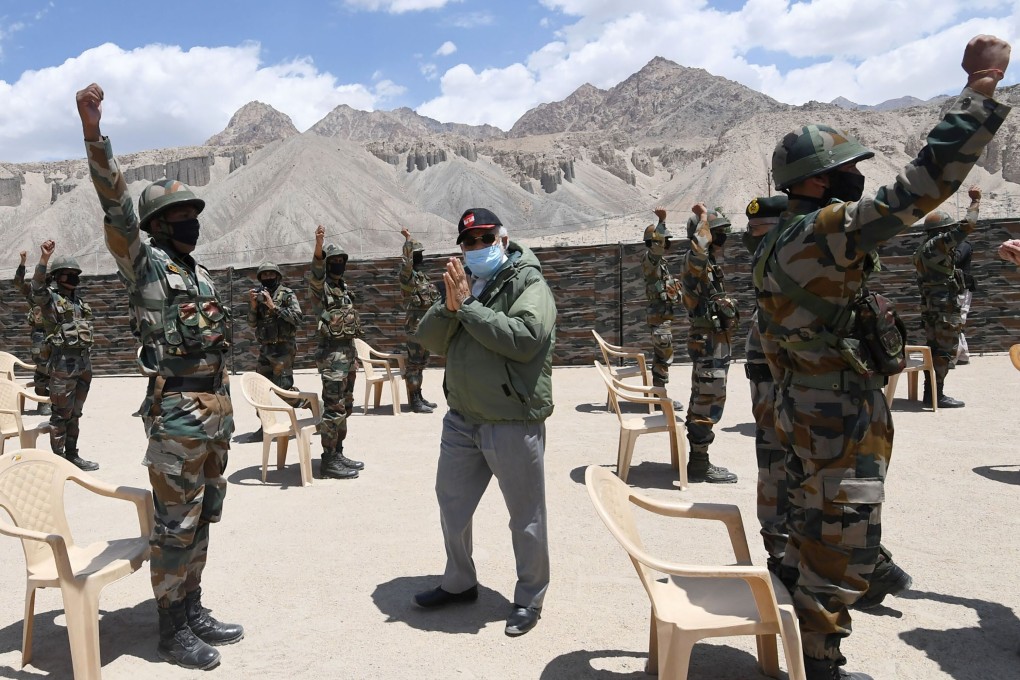Indian Prime Minister Narendra Modi greets soldiers during a visit to the Ladakh region. Photo: AP