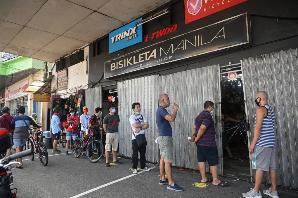A queue outside a cycle shop in Manila, the Philippines. Bicycle sales have surged since the Covid-19 pandemic. Photo: Ted Aljibe/AFP via Getty Images