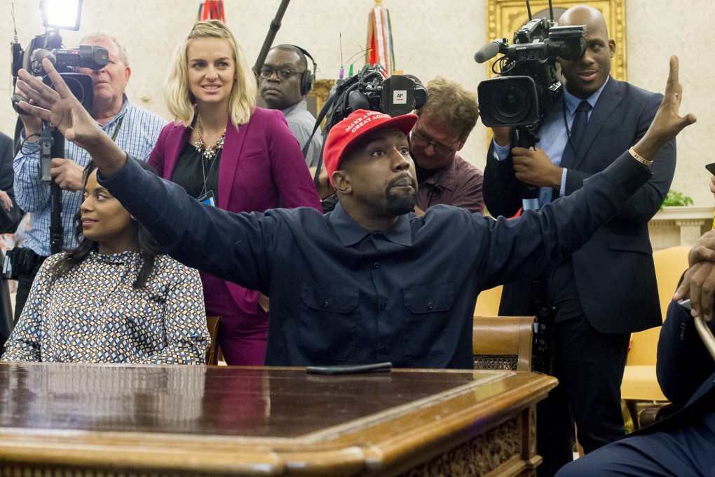 US entertainer Kanye West donned a red ‘Make America Great Again’ hat for a meeting with Donald Trump in the Oval Office in 2018. File photo: EPA