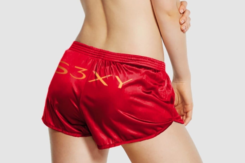 The shorts feature gold trim and ‘S3XY’ in gold across the back, which also happens to be formed from Tesla model names. Photo: Tesla