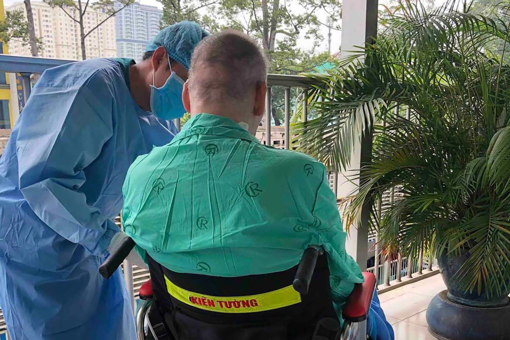 In this photo provided by Cho Ray Hospital, a doctor attends to Patient 91, a British pilot who survived Covid-19 after being critically ill. Photo: AP