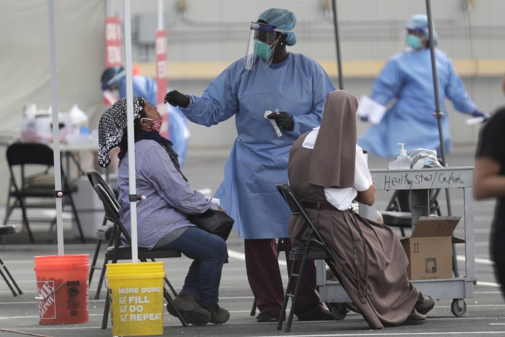 A health care worker administers a Covid-19 test in Homestead, Florida, on Monday. Photo: AP